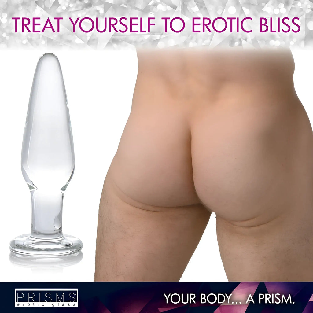 Prisms Erotic Glass 3pc Dosha Glass Anal Plug Kit: A clear, smooth, tapered glass anal plug next to human buttocks.