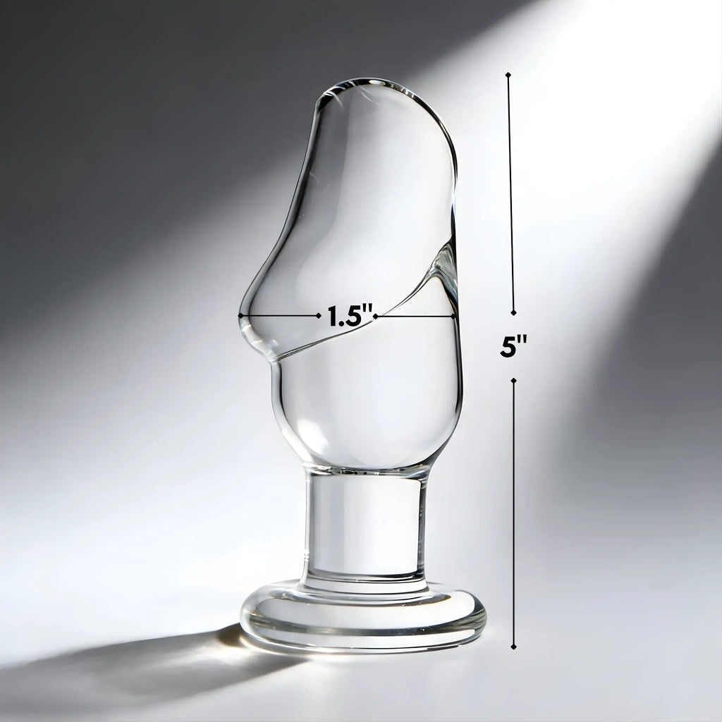 Prisms Erotic clear glass butt plug with a phallic-shaped head, measuring 5 inches tall and 1.5 inches wide.