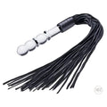 Prisms Erotic Glass Lingam Flogger featuring a clear, beaded glass handle attached to long, black leather strips.