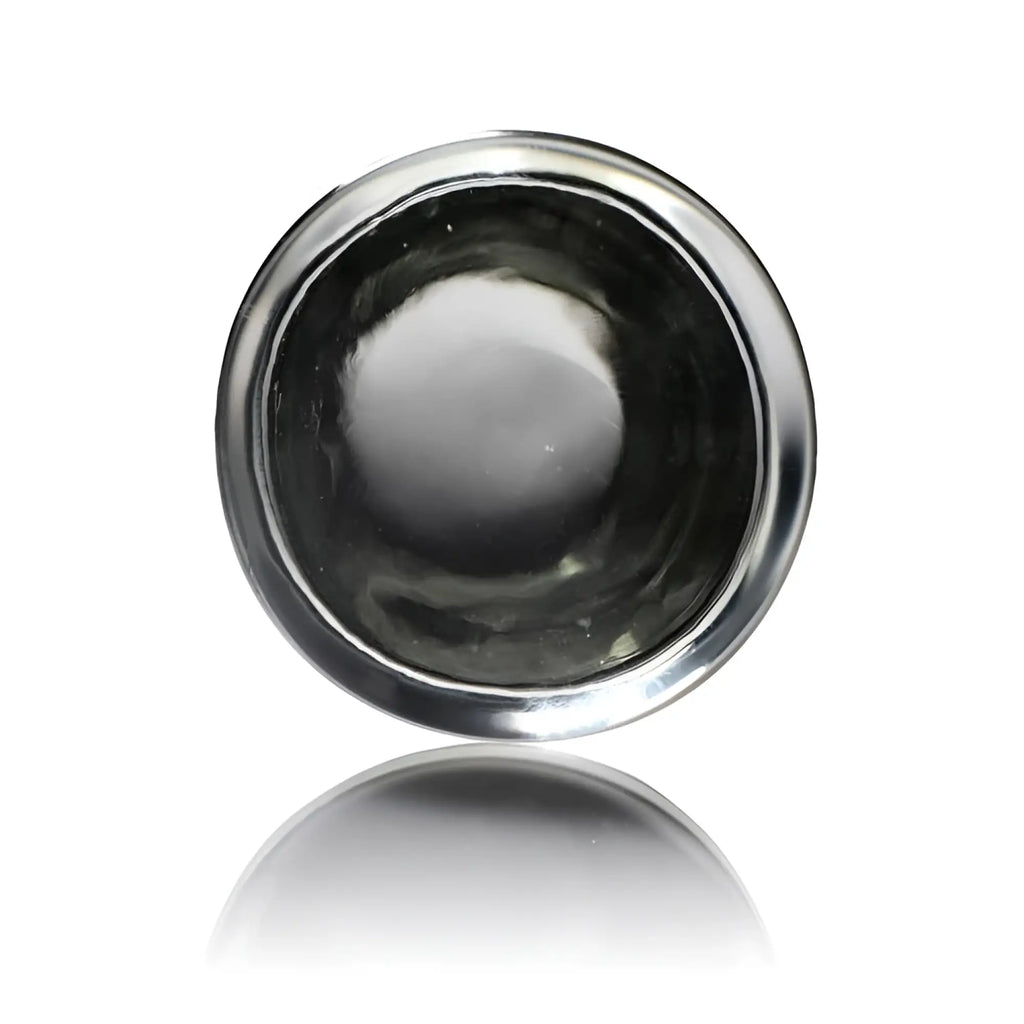 Top-down view of a clear, cylindrical Prisms Erotic Glass Pillar with a smooth, polished glass surface.
