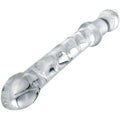 Prisms Prana Glass thrusting dildo: A clear, spiral-textured glass dildo with a flared base, set against a white background.