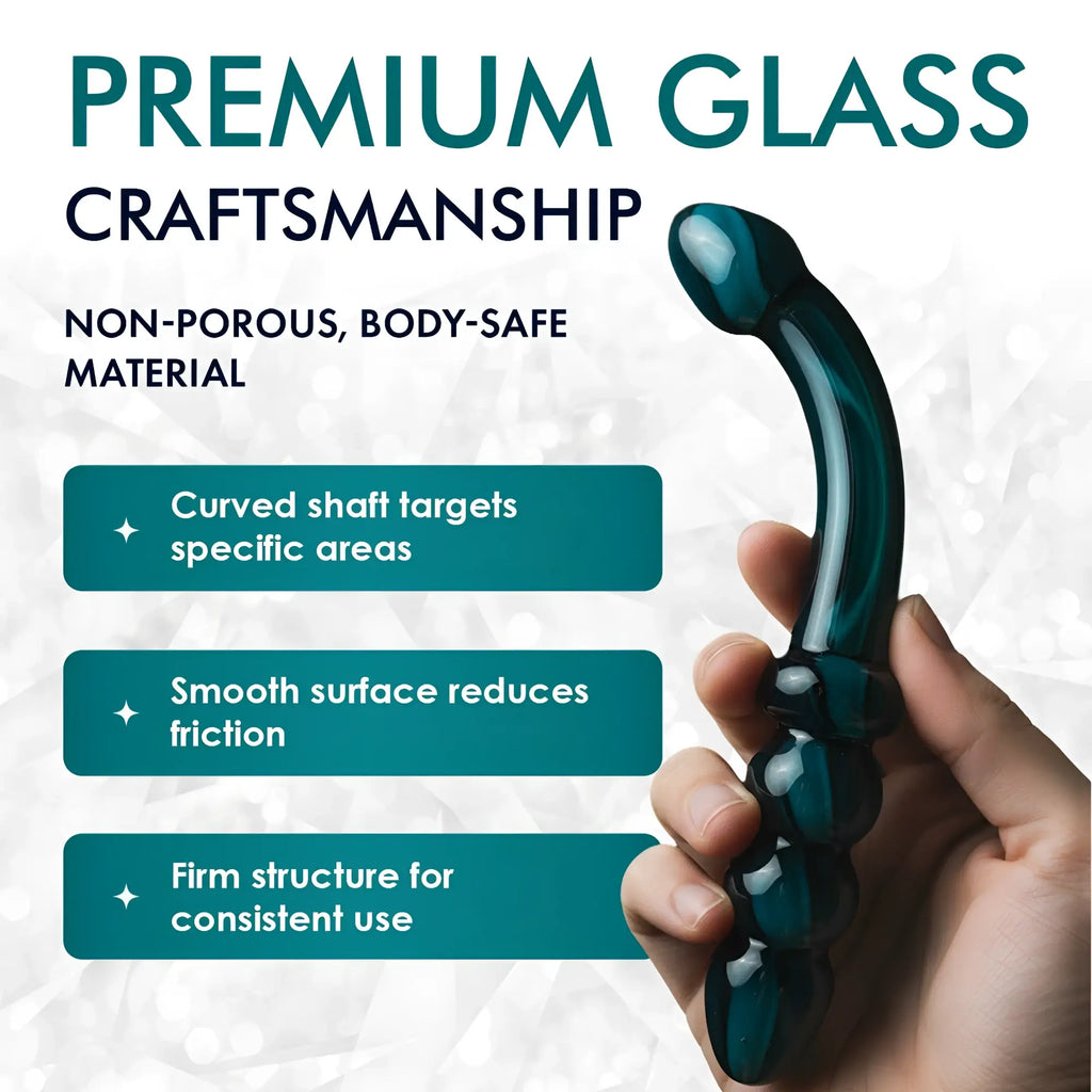 Prisms Smoky Jade curved glass dildo held in hand, featuring a smooth, swirled green design and a beaded base.