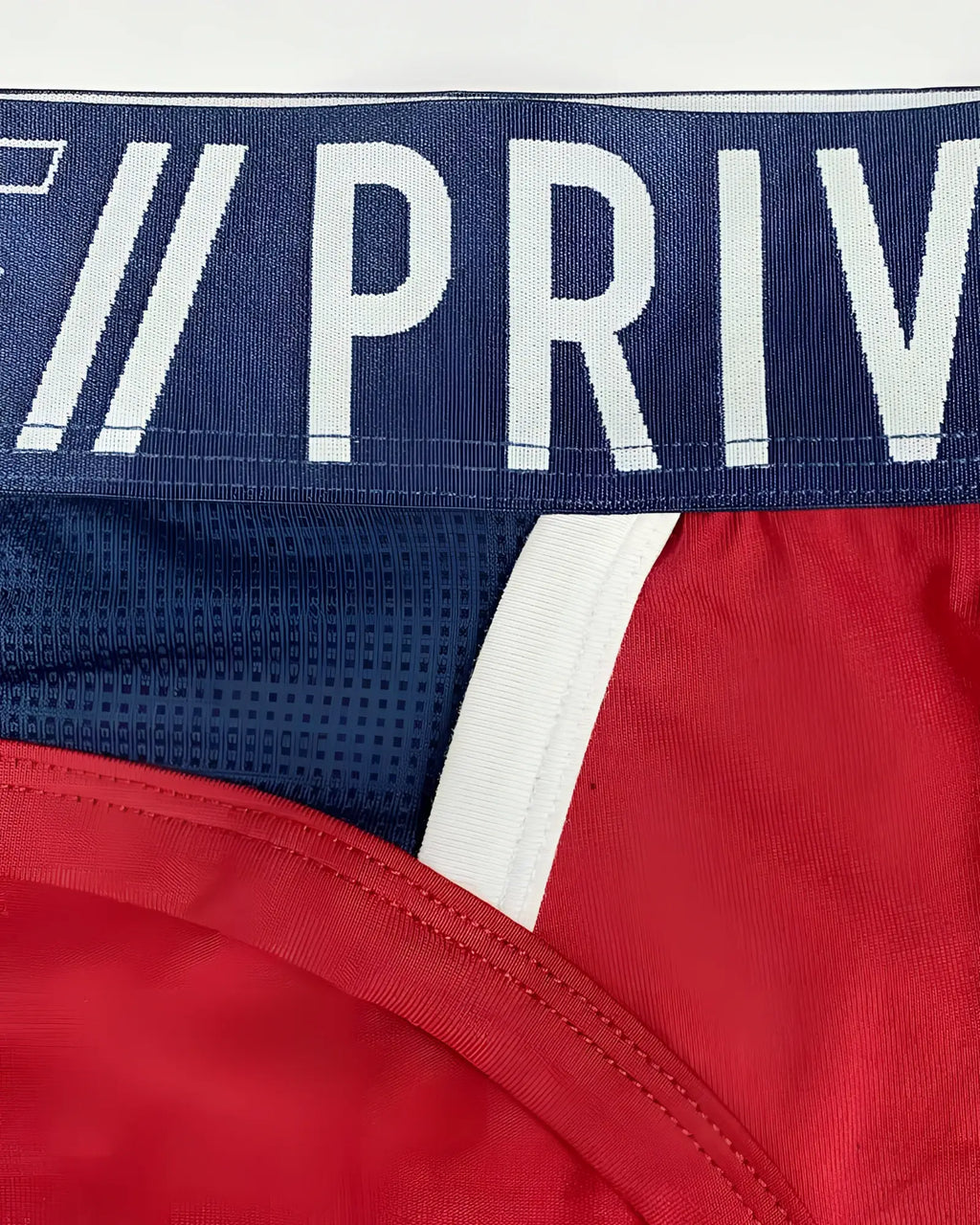 Navy blue and red athletic briefs with white trim and priv logo waistband by private structure for active use