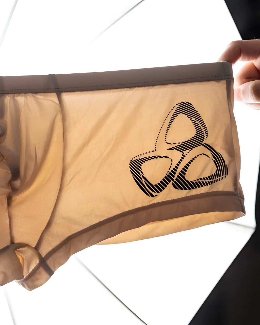 Tan mesh briefs with black geometric logo on front in private structure brut4390 bare hipster color nude