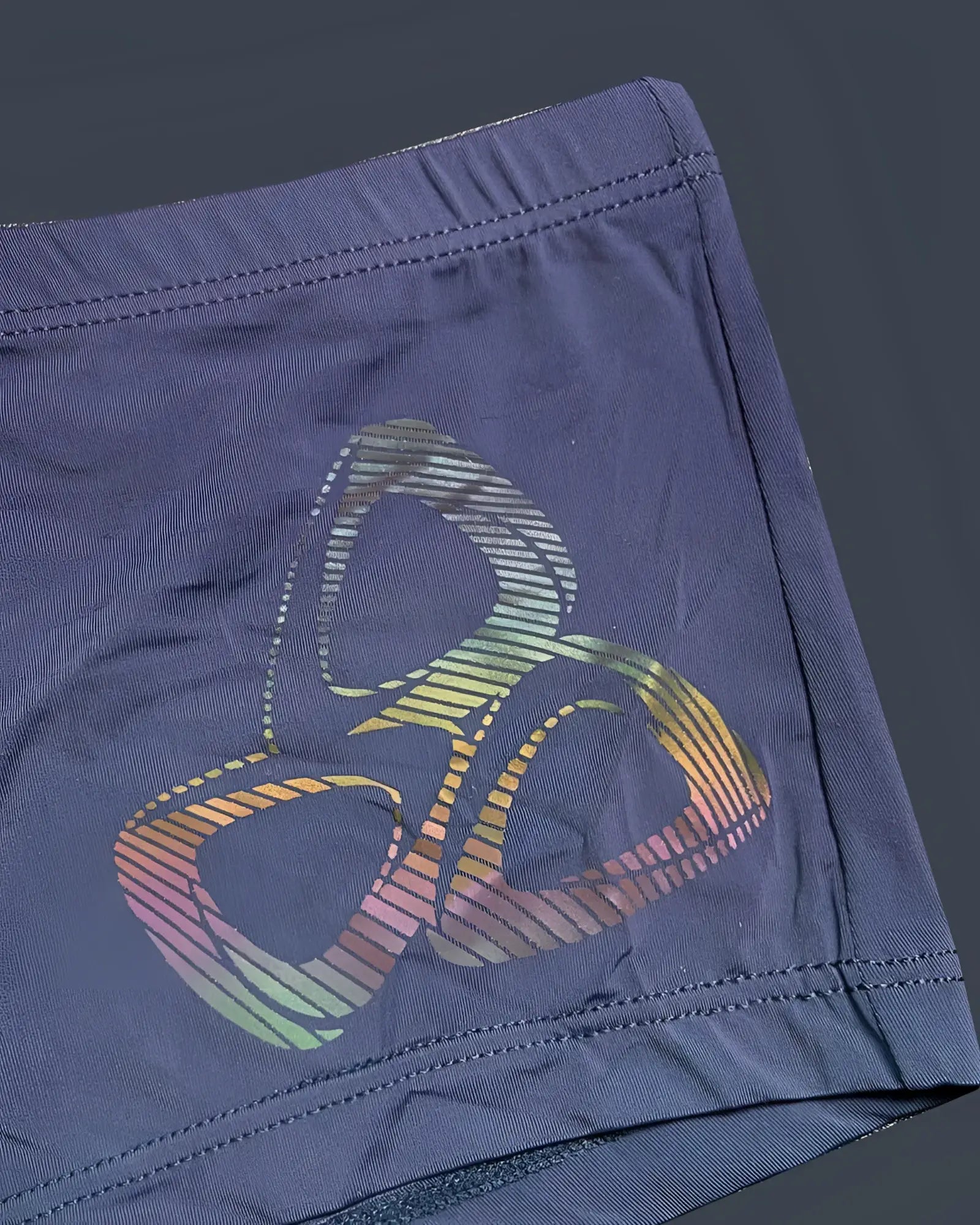 Dark blue Private Structure BRUT4390 bare hipster shorts with rainbow-striped abstract logo in silk navy fabric