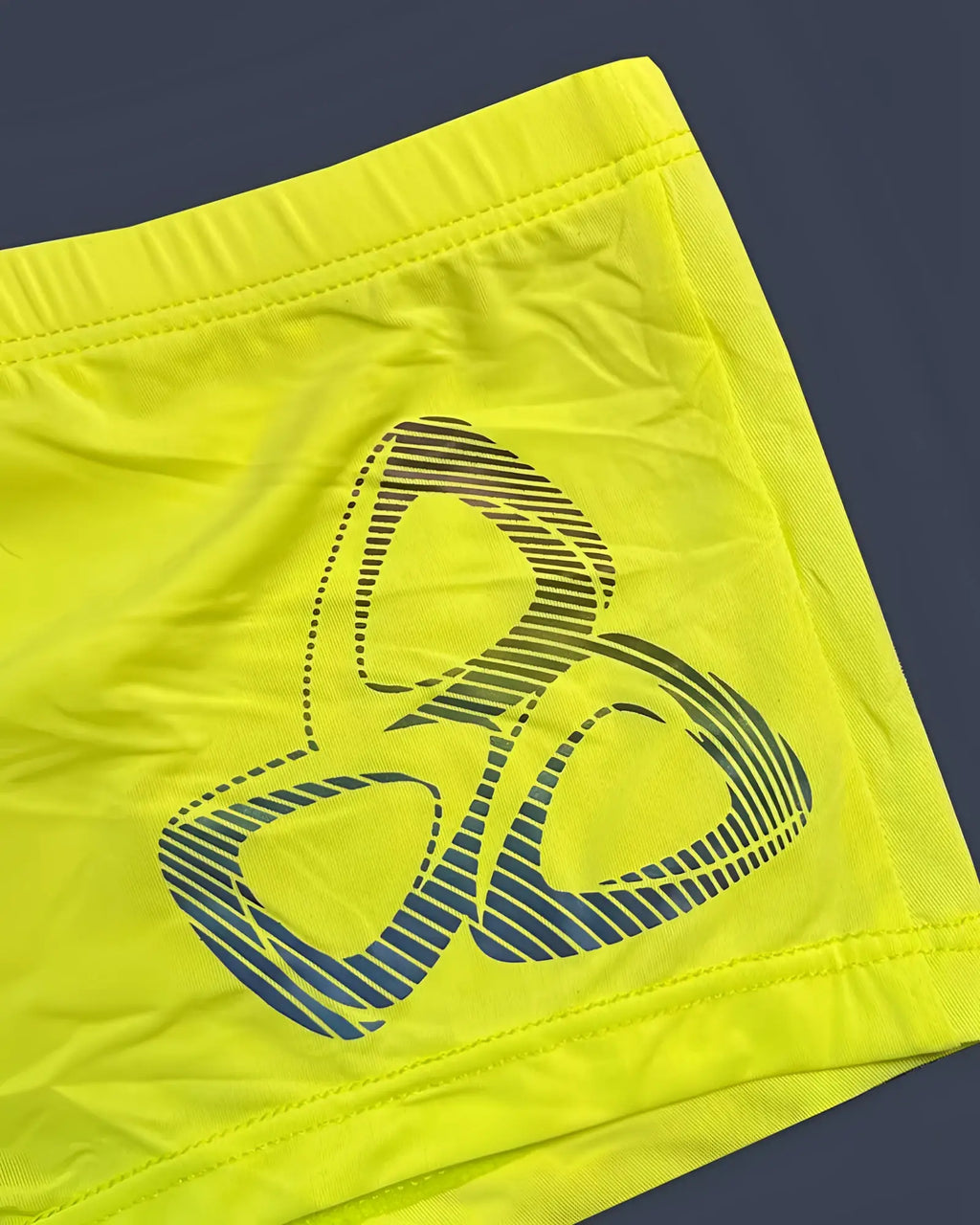 Bright neon yellow private structure brut4390 bare hipster shorts with a bold blue and black three-ring logo design