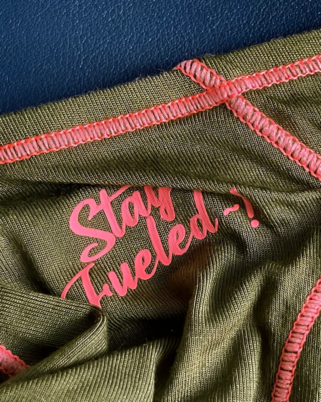 Olive green ribbed fabric private structure prime eutopia bikini brief with pink embroidered text and stitching