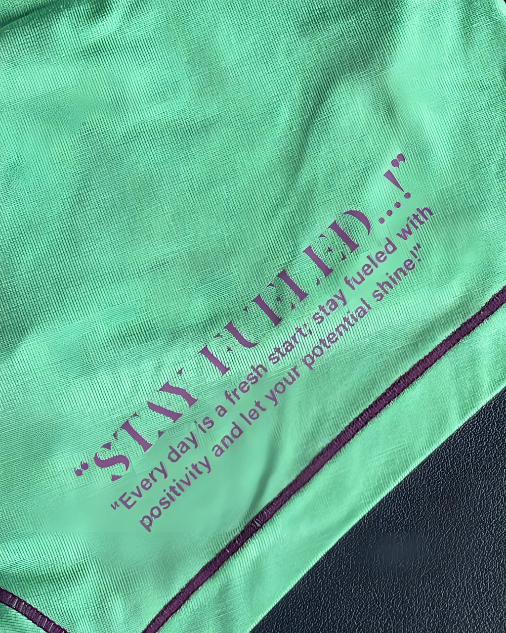 Vibrant green cotton t-shirt with purple stay fueled slogan and stitching from private structure prime elysian hipster cyan