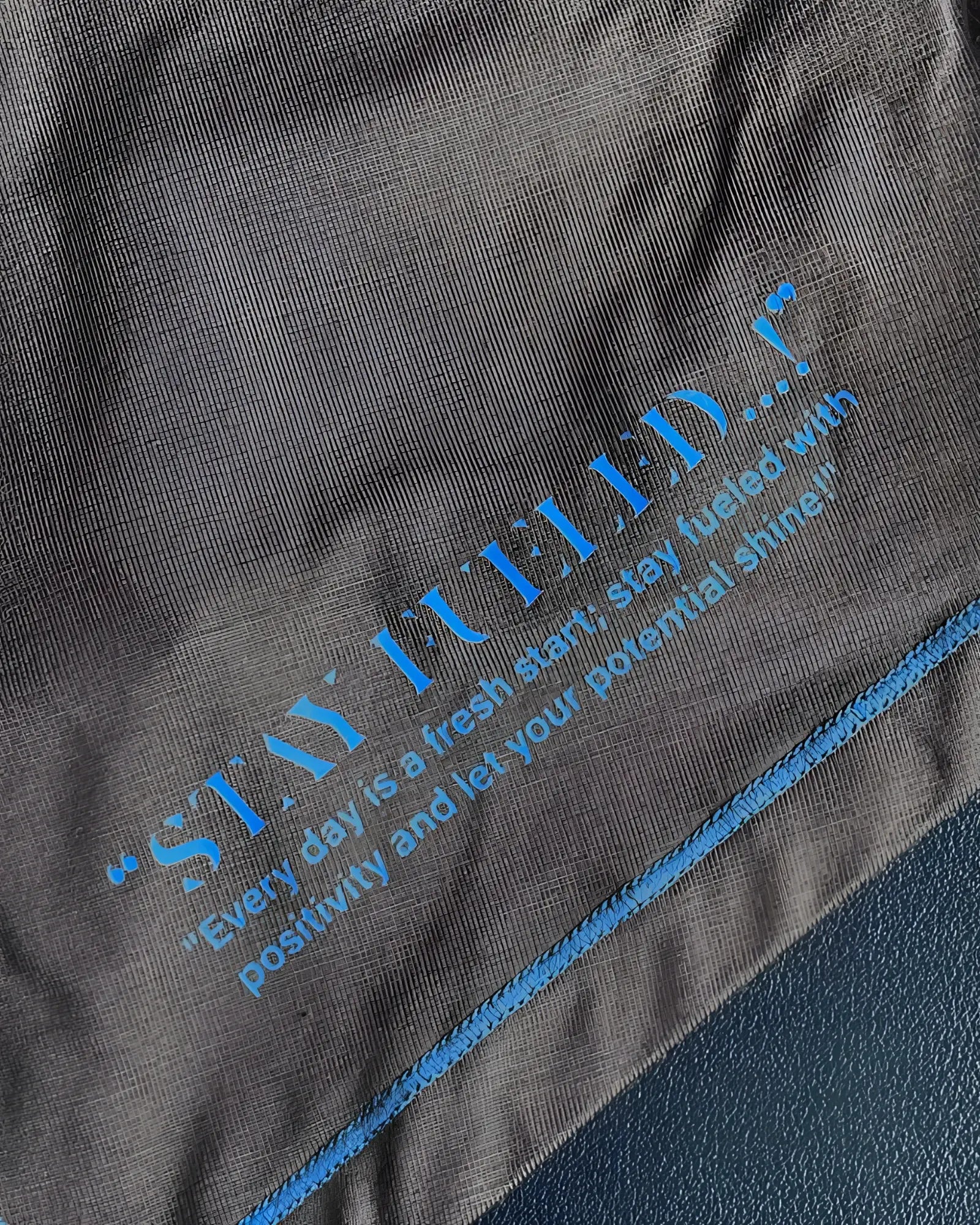Dark gray cotton t-shirt private structure epus4570 with blue printed quote and matching blue stitching along the seam