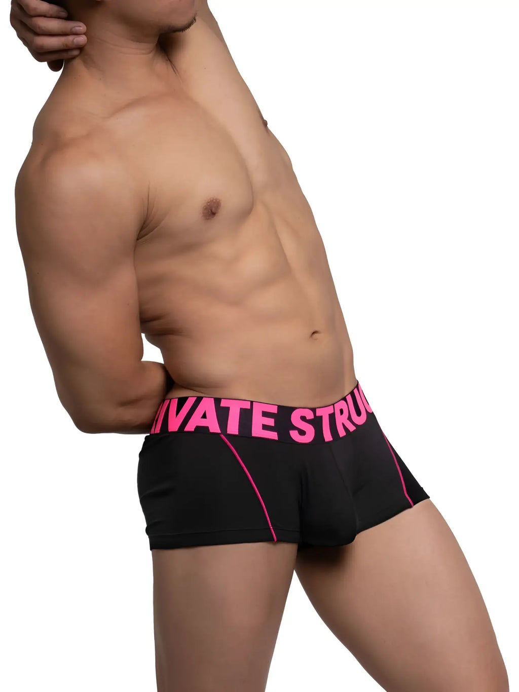 Black boxer briefs with vibrant pink trim and bold private struggle lettering on the waistband by Private Structure