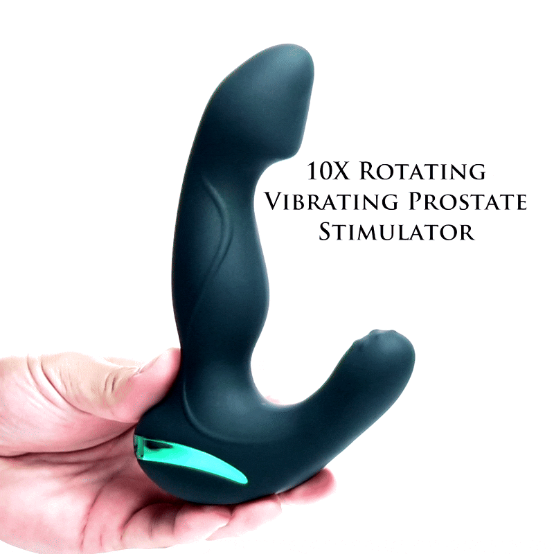 Hand holding a matte black, dual-pronged Mega Maverick prostate stimulator with a glowing green accent base.