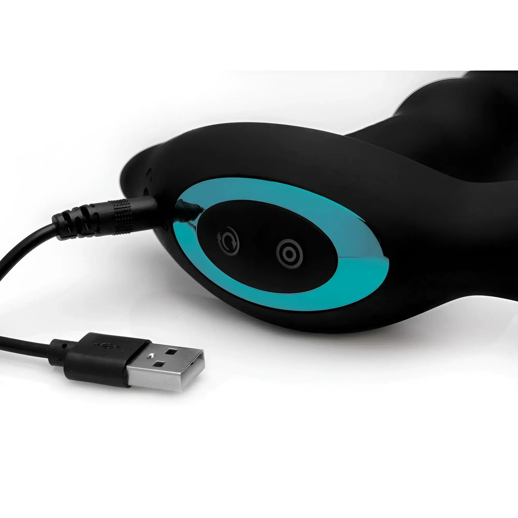Prostatic Play Rimstatic plug, matte black curved design with turquoise metallic accents and USB charging cable.