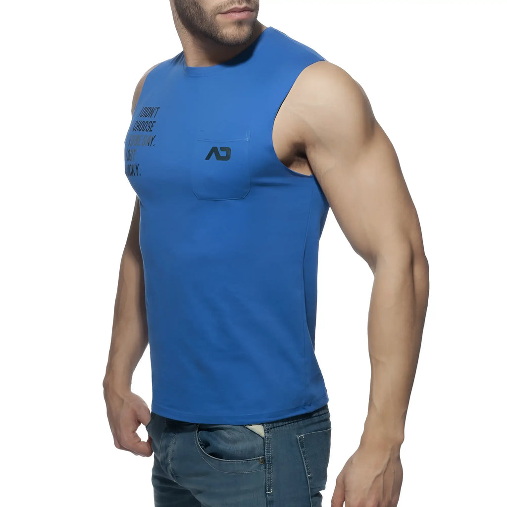 Blue sleeveless tank top with chest pocket and black text on left side in proud 2 be gay t-shirt design