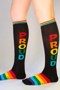 Black knee high socks with rainbow proud lettering and matching rainbow striped cuff and toe for pride wear