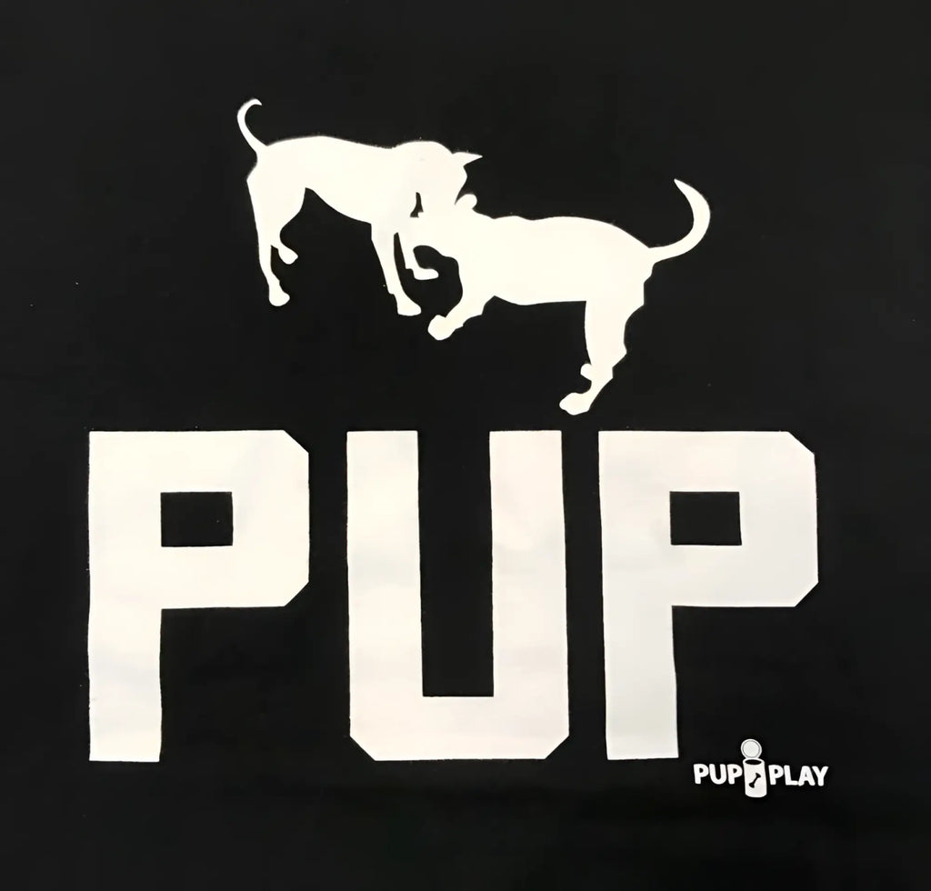 Black premium cotton t-shirt featuring a white silhouette of two playful dogs above the bold word pup and pup play logo
