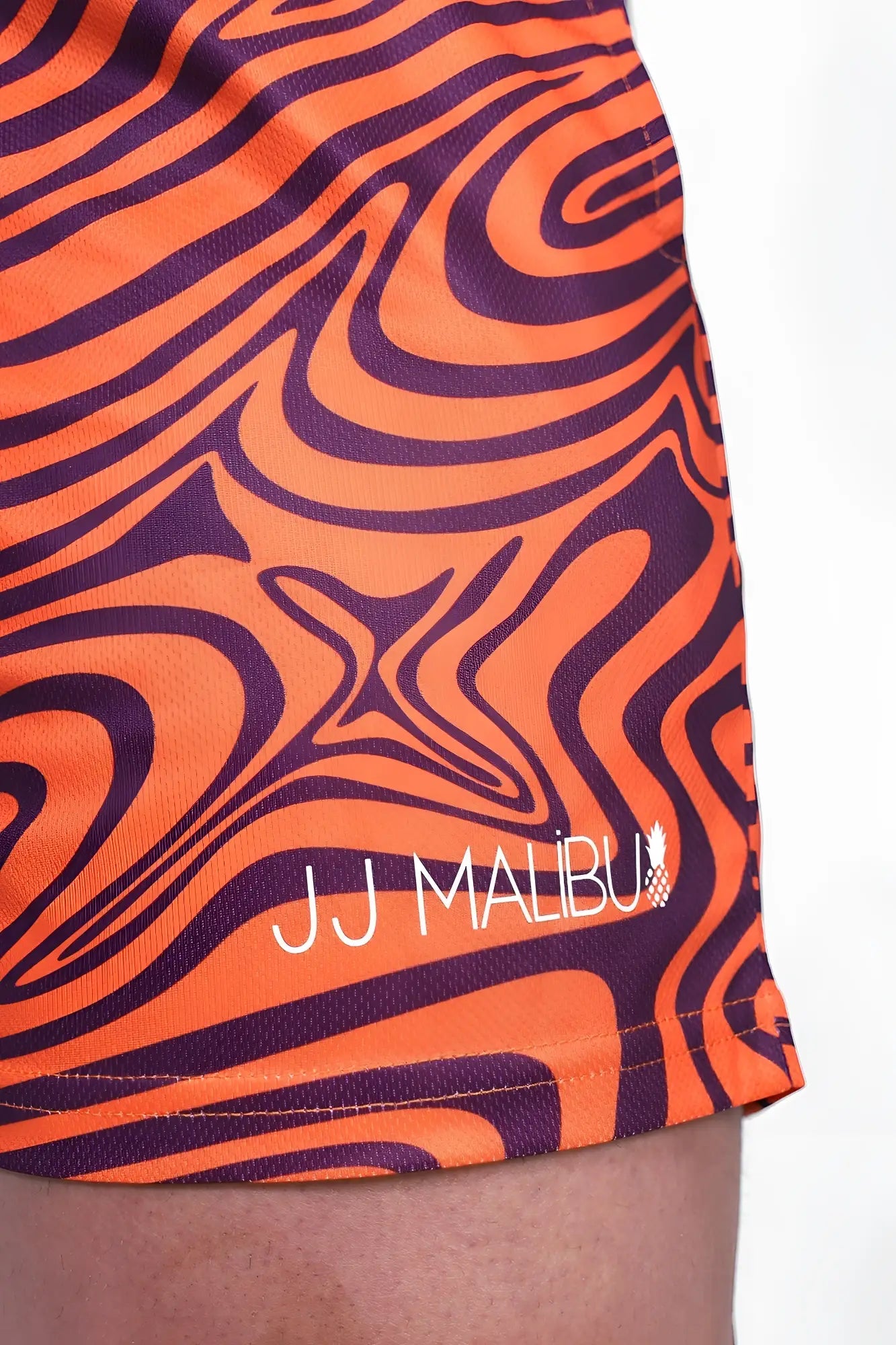 Quick-dry mesh shorts in orange and purple swirl pattern with jj malibu branding for swimwear use