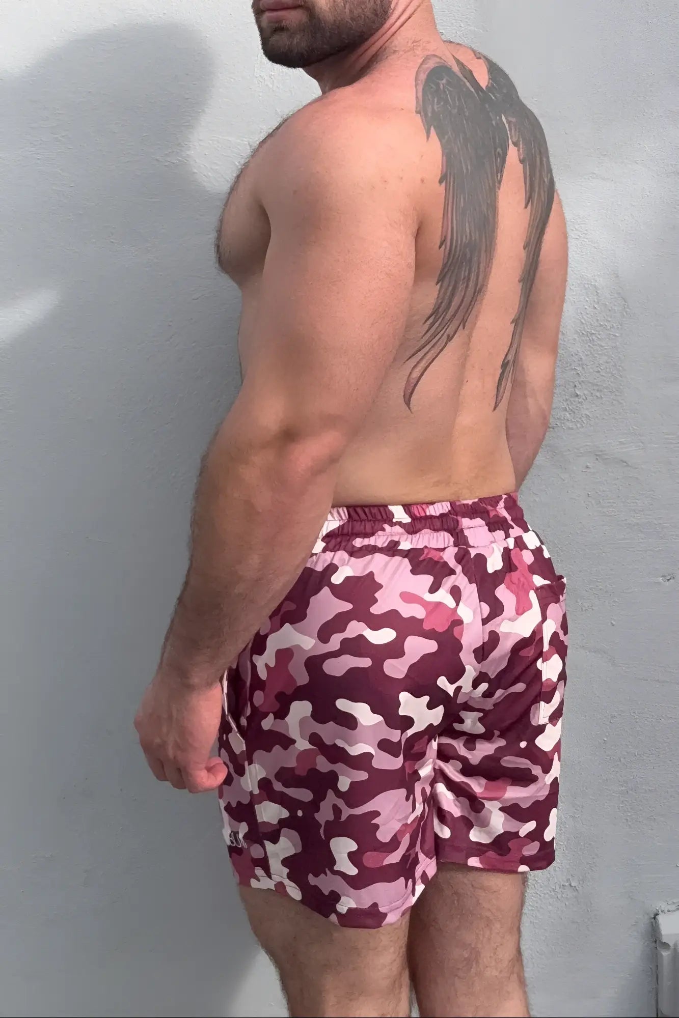 Quick-dry mesh shorts in maroon and pink camouflage pattern made for swimwear use