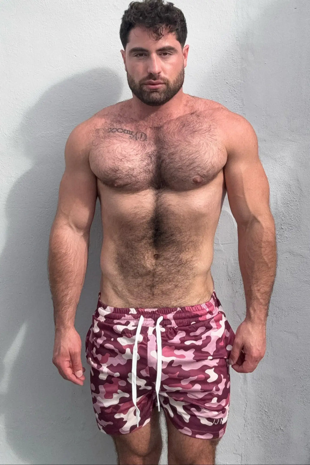 Purple camo quick-dry mesh shorts with maroon and white camouflage pattern and white drawstrings for swimming