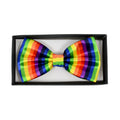 A vibrant rainbow bow tie with bold vertical satin stripes in red orange yellow green blue and purple