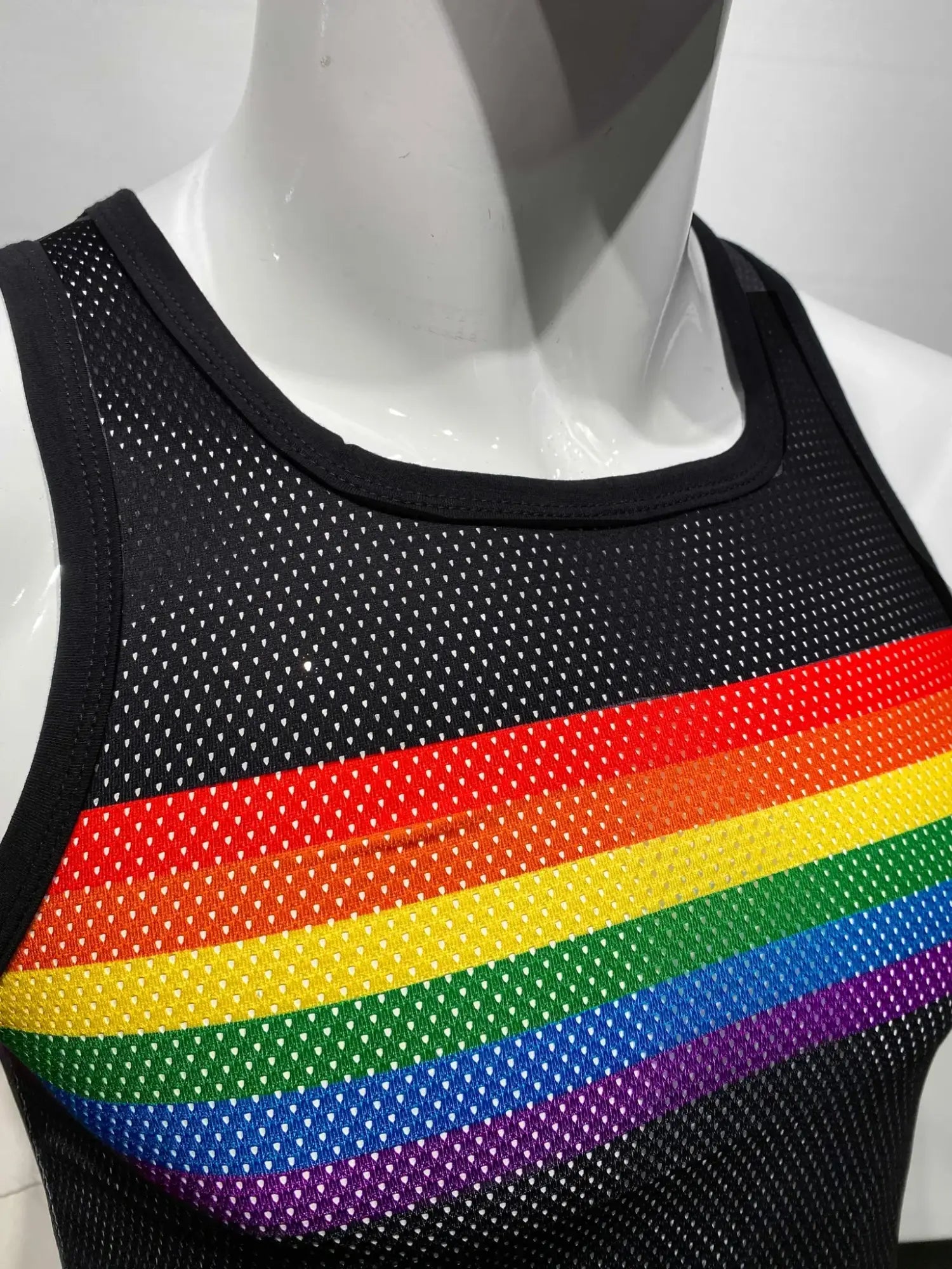 Black mesh tank top with a vibrant rainbow chest stripe from the rainbow chest stripe mesh tank collection