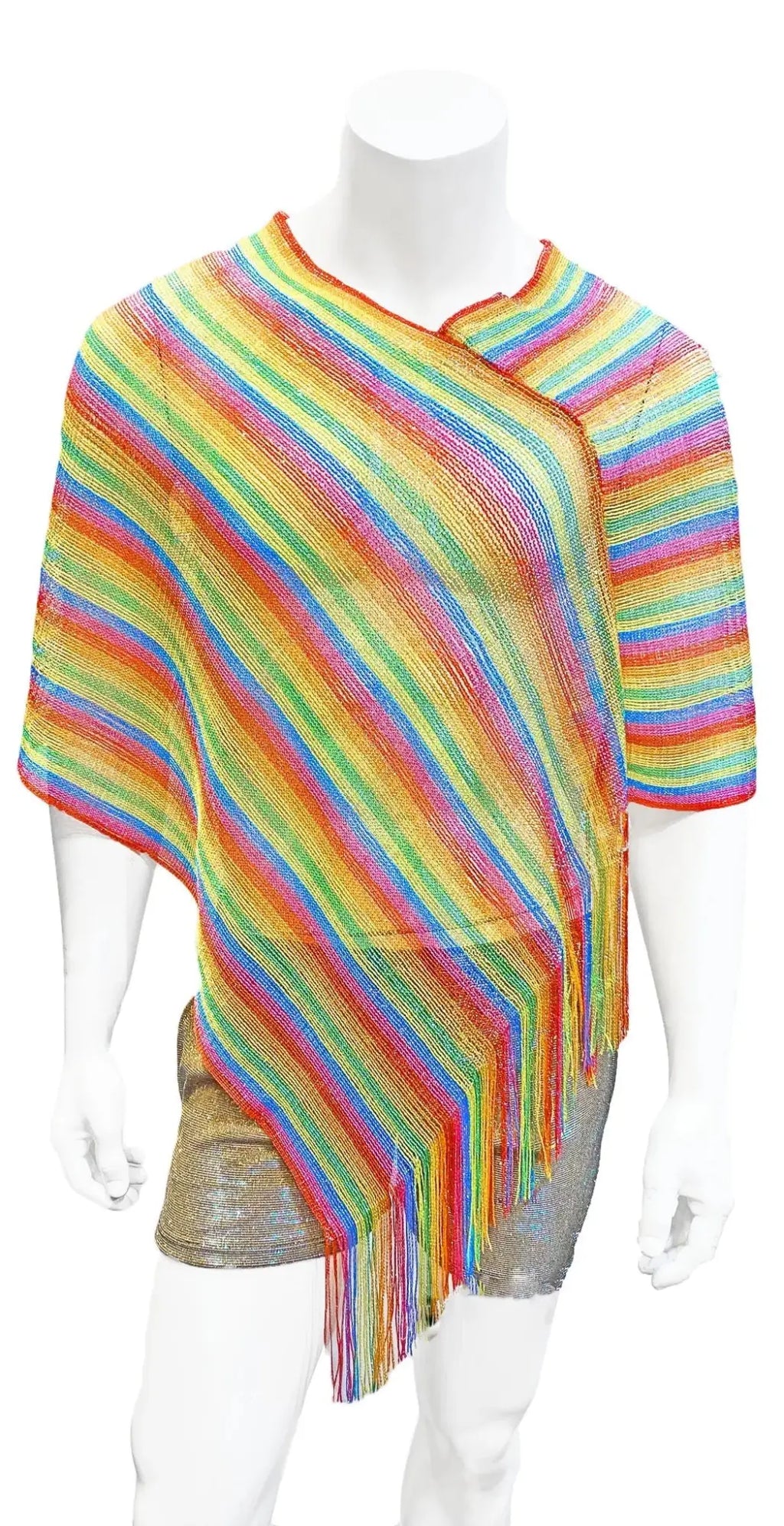 Rainbow glitter poncho knitted with rainbow stripes and fringe detailing for vibrant layered warmth