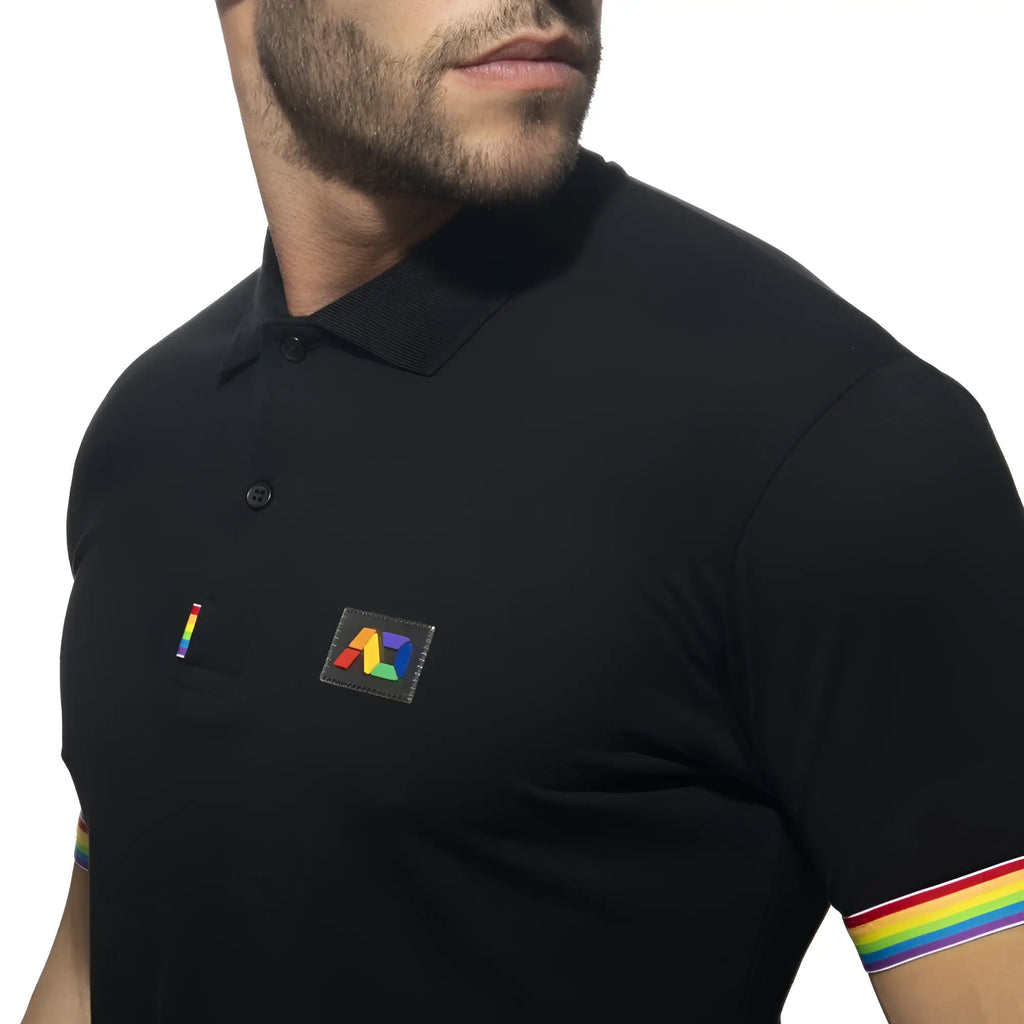 Black polo shirt with rainbow-colored trim on the sleeve and matching rainbow logo patch on the chest
