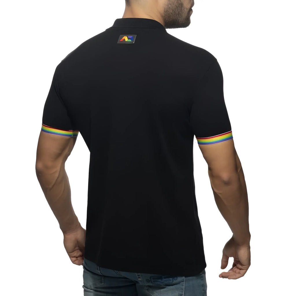 Black rainbow polo shirt back view with rainbow-striped cuffs and a small colorful logo on the collar
