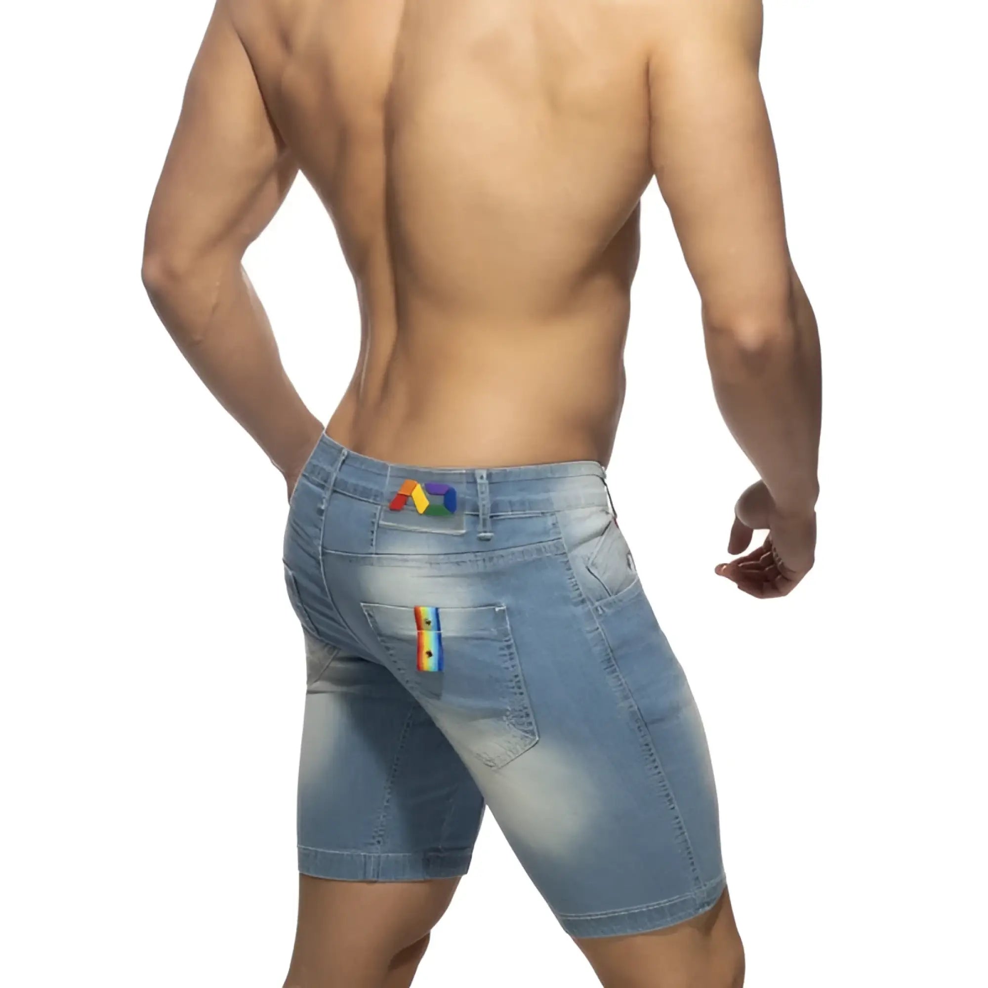 Back view of light-wash denim rainbow tape jean shorts with rainbow patches on waistband and right pocket
