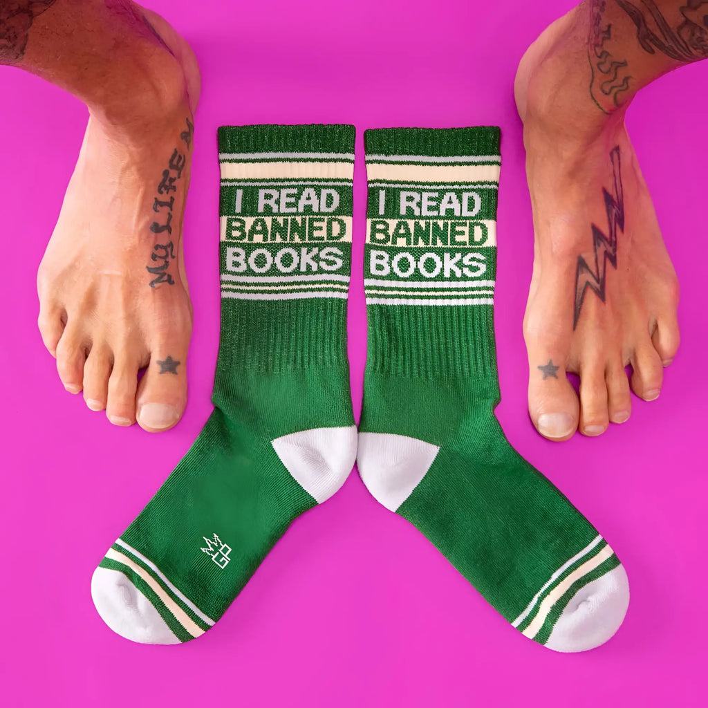 Green crew socks with white accents and bold i read banned books text featuring ribbed texture and reinforced toes