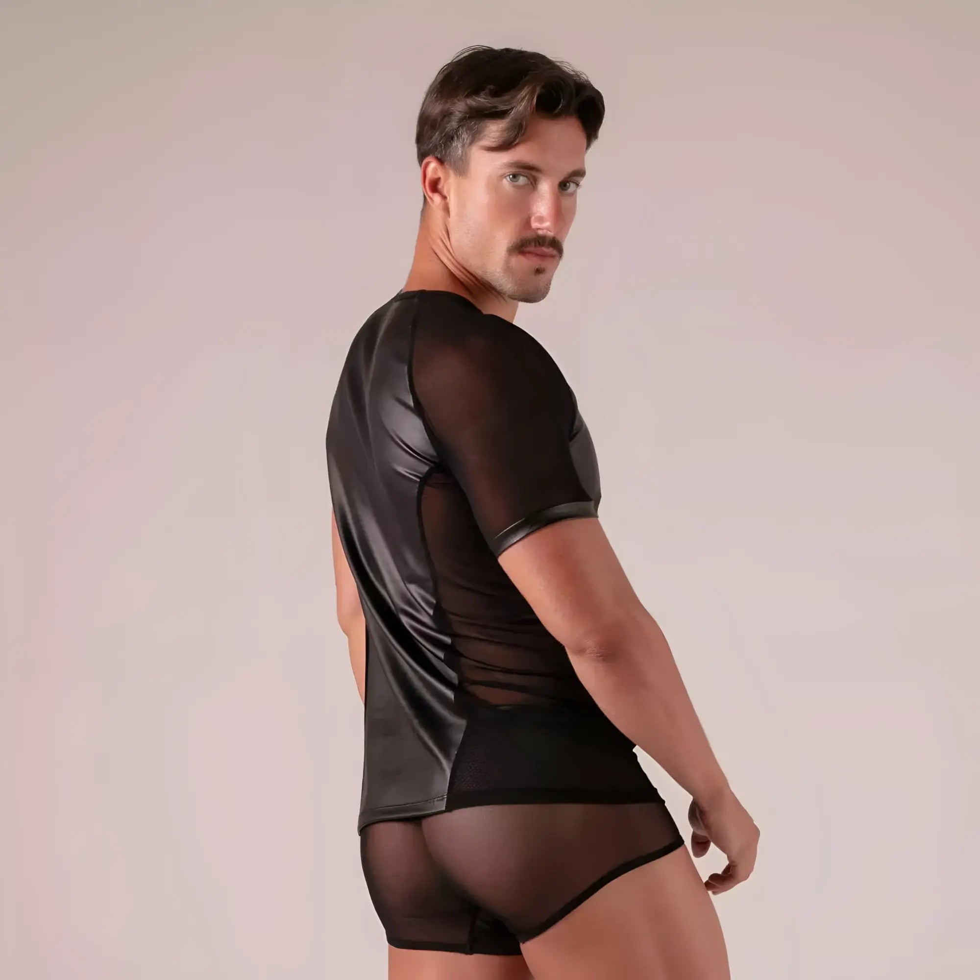 Black faux leather rebel t-shirt with short sleeves and sheer mesh panels for edgy casual wear
