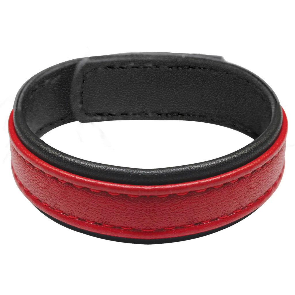 Red leather cock ring with velcro featuring a red and black leather wristband with contrasting stitching