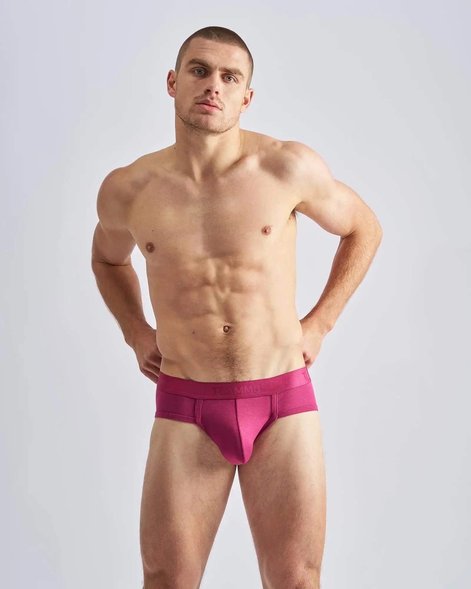 Vibrant fuchsia reign brief athletic briefs with sleek form-fitting design and smooth fabric waistband for active wear