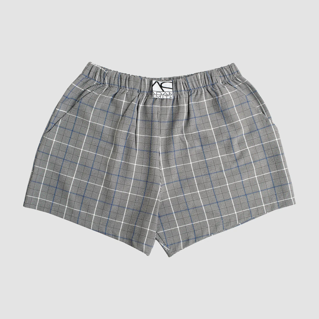 Gray and white plaid relax boxer with pockets featuring a subtle blue grid pattern and elastic waistband with branded tag