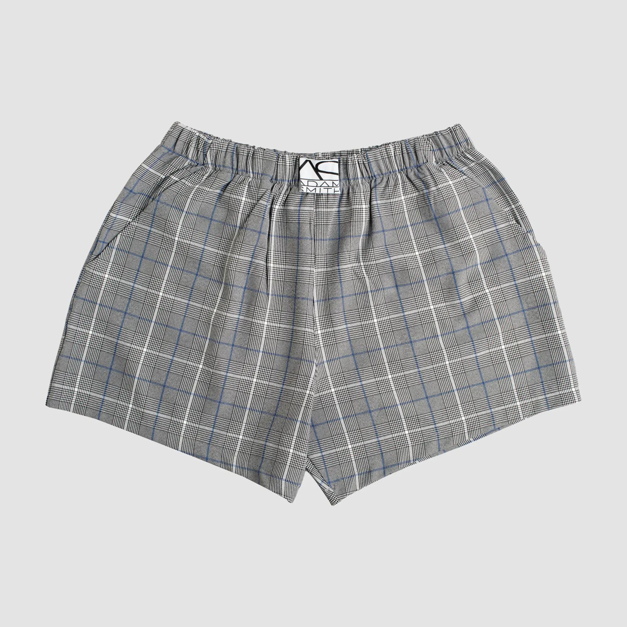 Gray and white plaid relax boxer with pockets featuring a subtle blue grid pattern and elastic waistband with branded tag