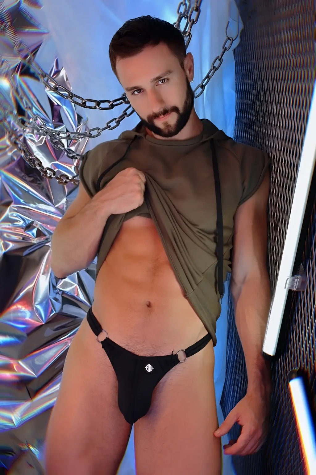 Black thong with silver hardware and diamond-like embellishment featuring in renegade raw hoodie product image