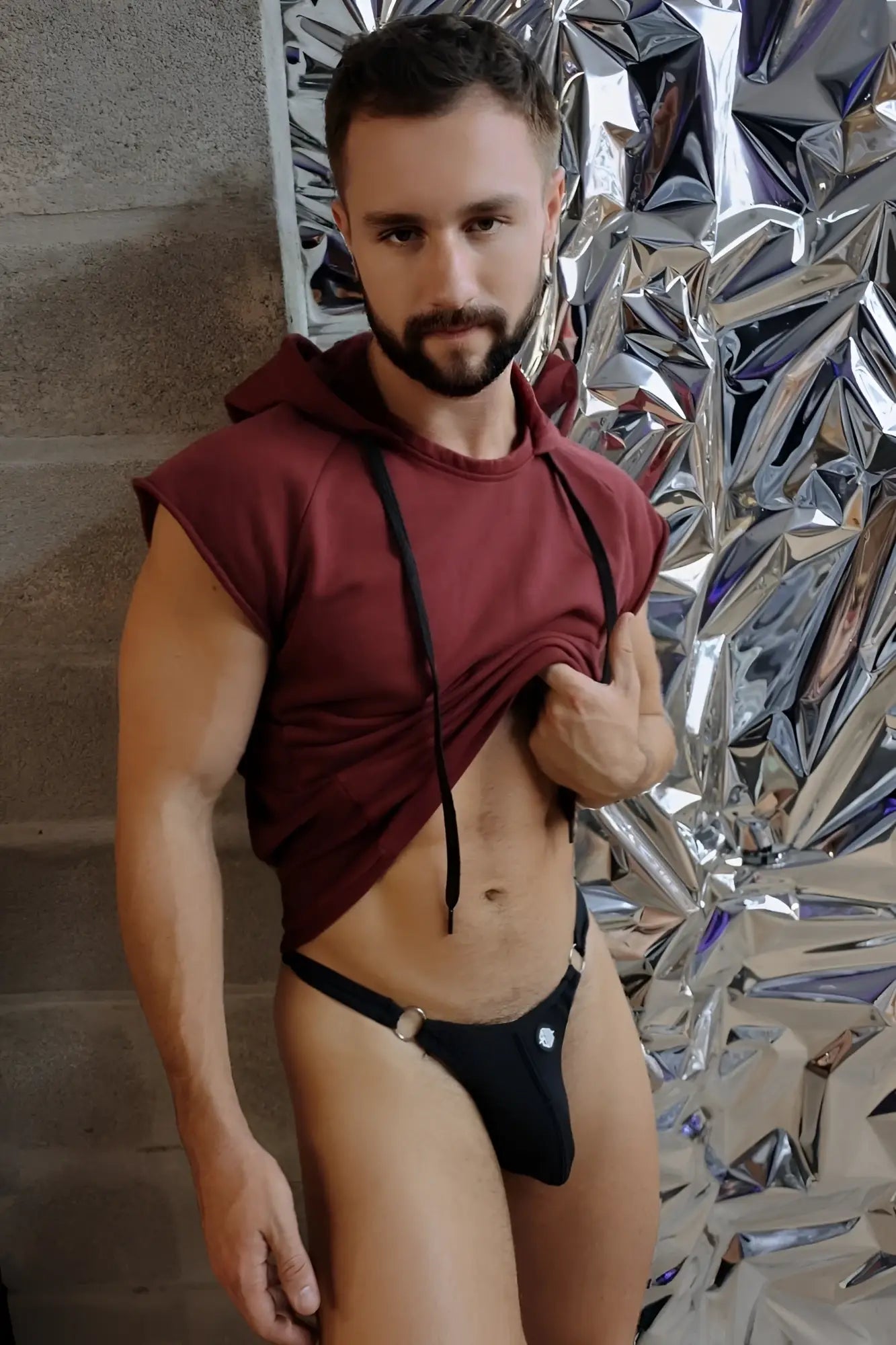 Black thong with silver-toned metal clasps shown from the back side highlighting edgy accessory details