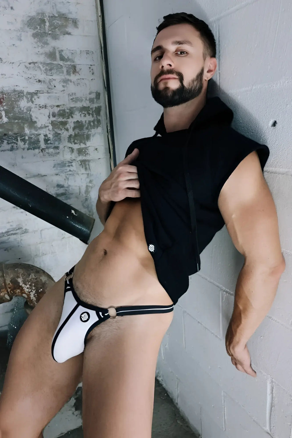 White and black thong with circular logo on front for casual wear in renegade raw hoodie collection