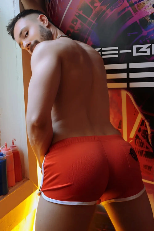 Retro remix shorts back view bright red athletic shorts with white trim and small black logo ideal for workouts