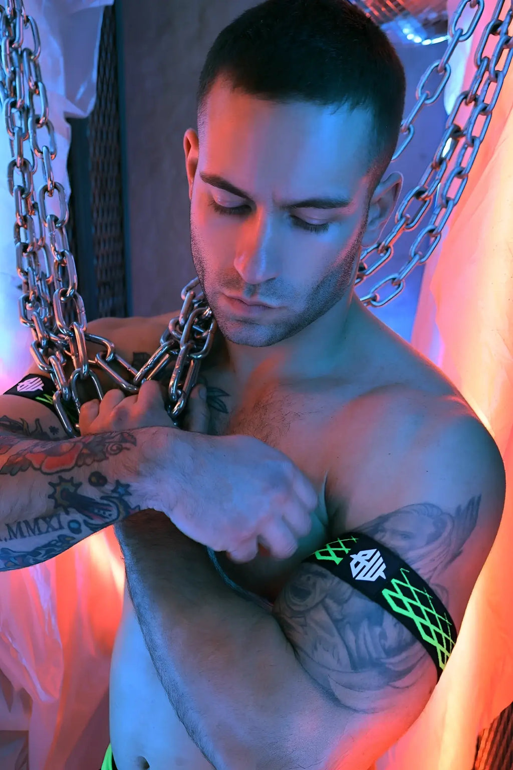 Black and neon green patterned revolution armband with a white logo designed for comfortable fitness use
