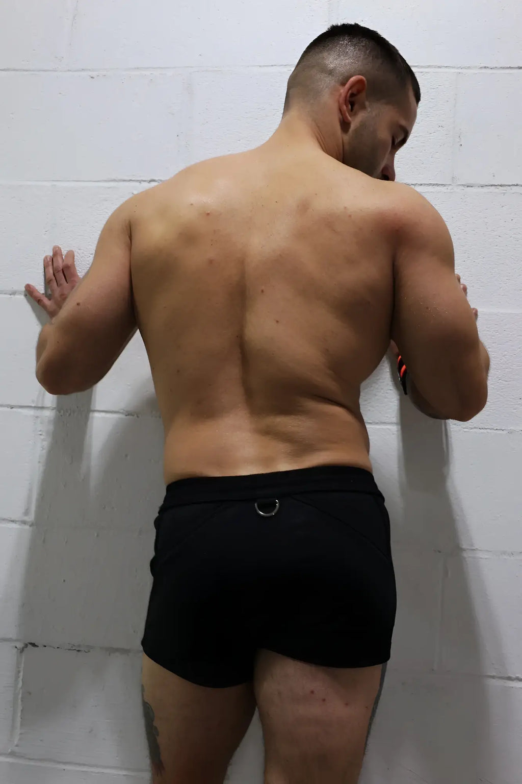 Black Revolution shorts with silver metal ring at waistband designed for athletic performance and comfort