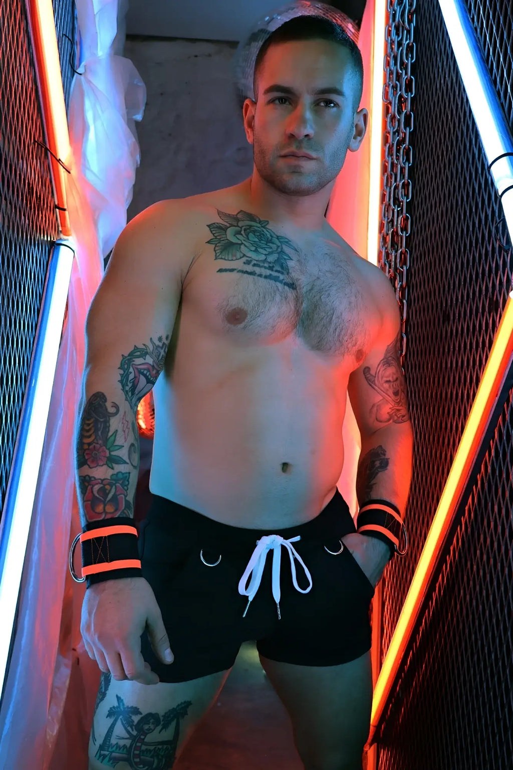 Black revolution shorts with white drawstring and orange accent bands on the wrists made from breathable fabric