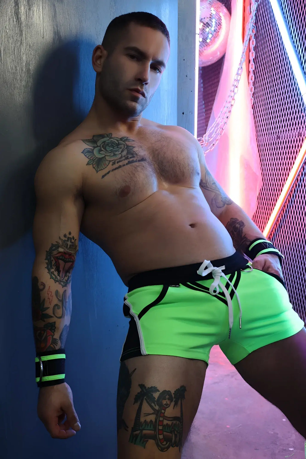 Neon green revolution shorts with black trim and white drawstring designed for athletic performance