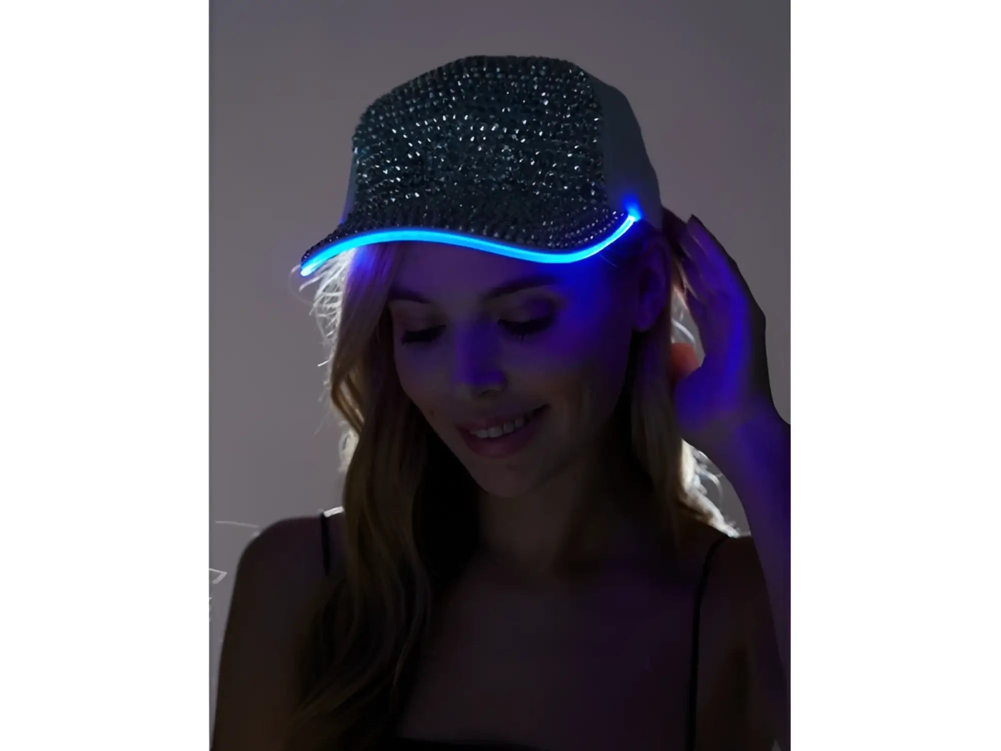 A sparkling black rhinestone cap with glowing blue led trim designed as a stylish light up cap