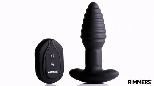 Rimmers Model-E black, ribbed vibrating plug next to its matching remote control on a white background.