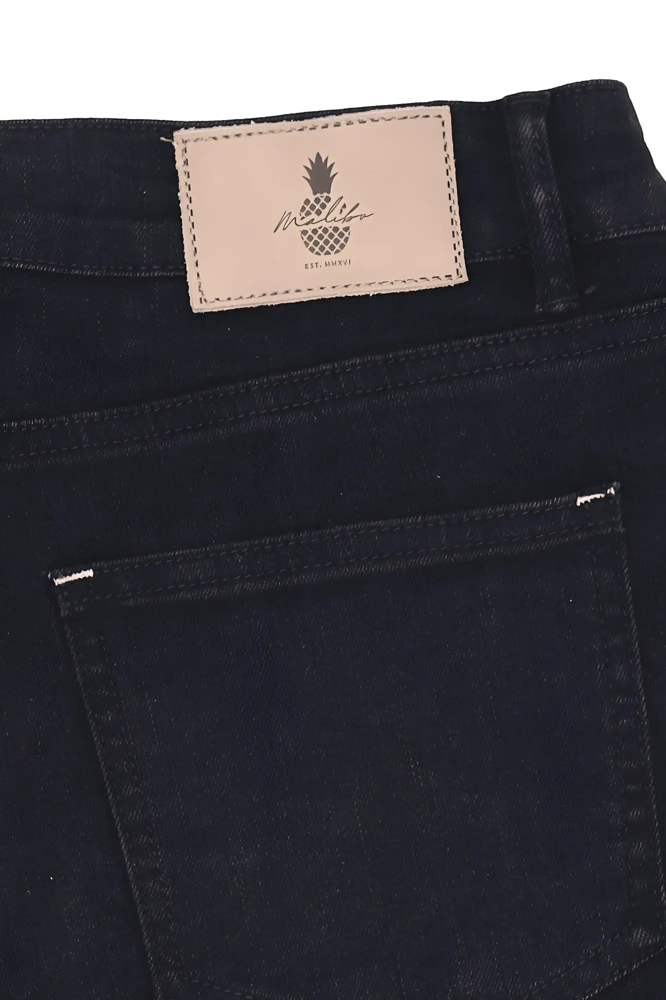 Black denim rockstar raw cut 2.5 inch short shorts with beige leather patch featuring pineapple logo on back waistband