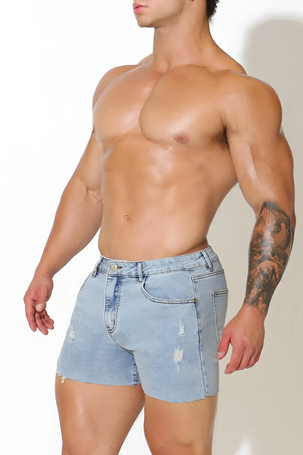 Rockstar raw cut 2.5 inch light-wash denim short shorts with distressed details and frayed hem in capri blue