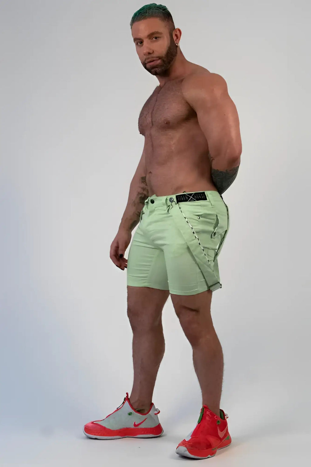 Light green Romey shorts with black belt and stitched detailing made for casual wear