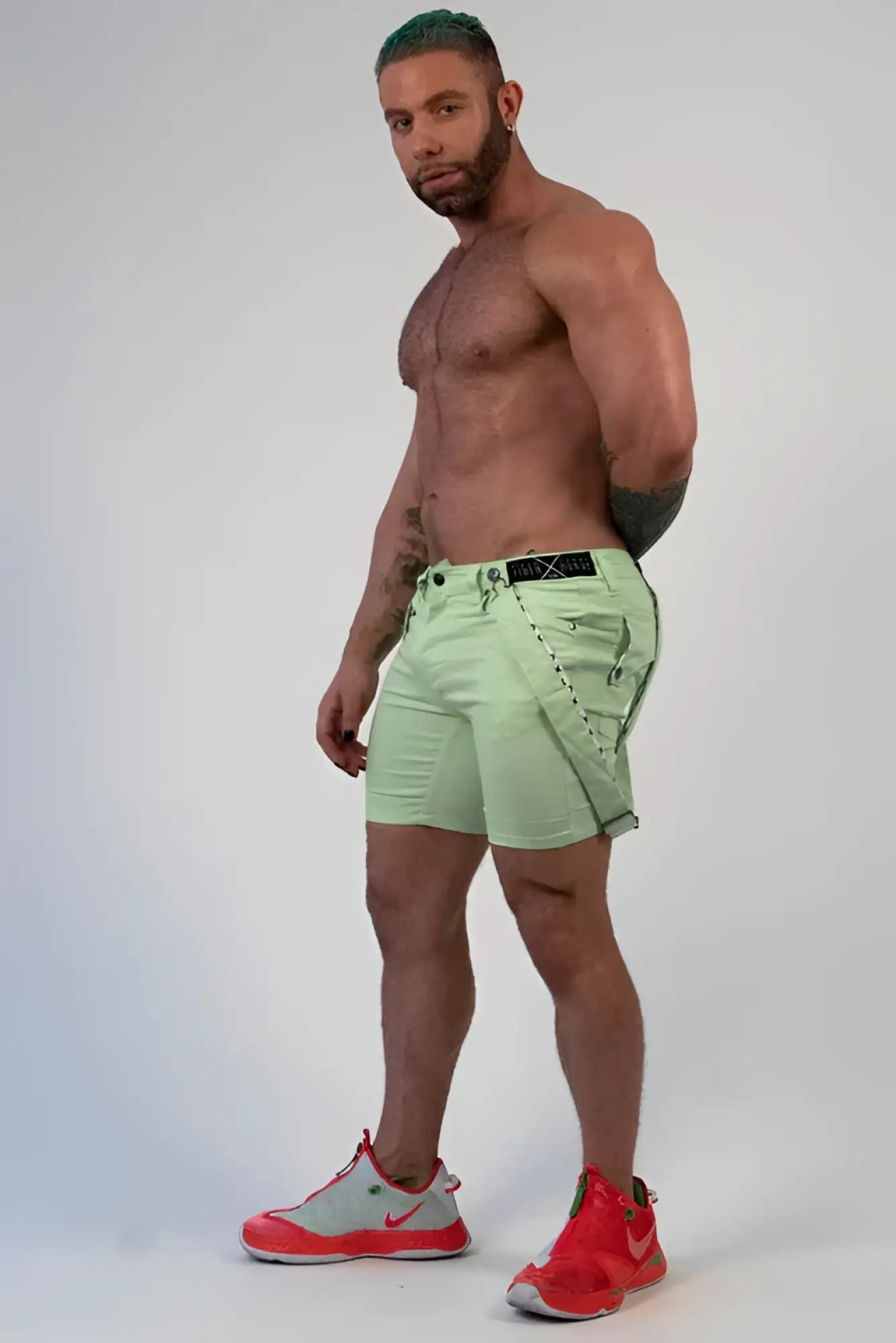Light green Romey shorts with black belt and stitched detailing made for casual wear