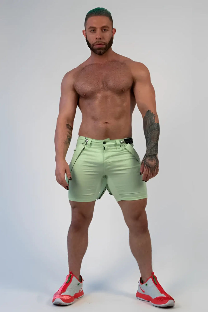 Light green romey shorts with subtle sheen and visible stitching details for casual wear