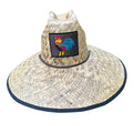 Beige woven straw lifeguard hat with wide brim navy blue trim and embroidered rooster patch on the front